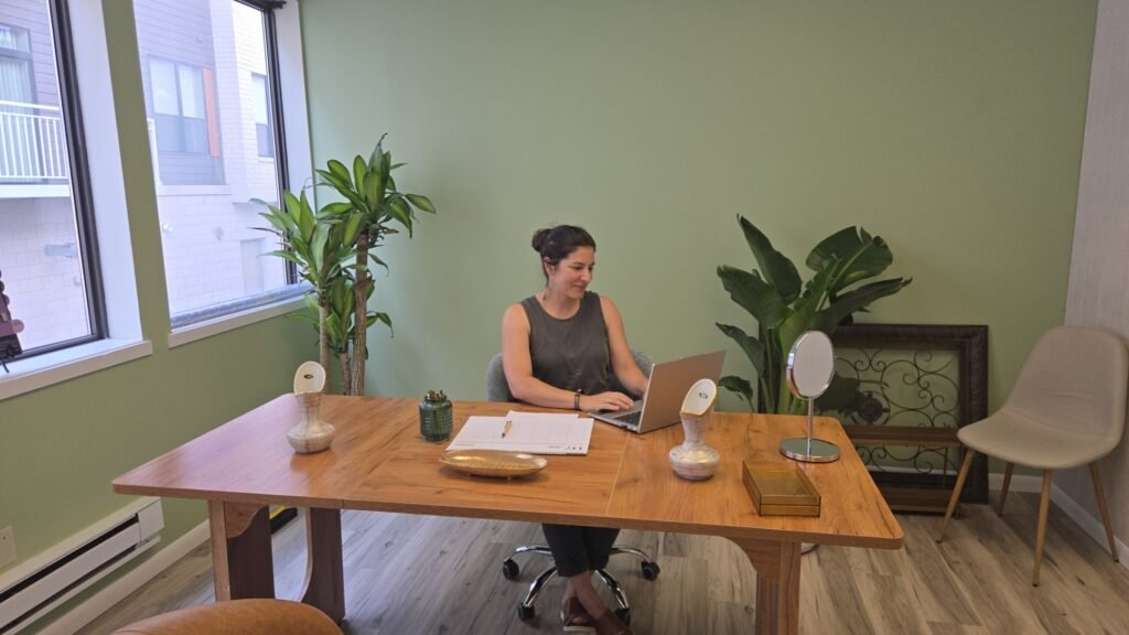 Emilia ruiz MD sitting at her desk